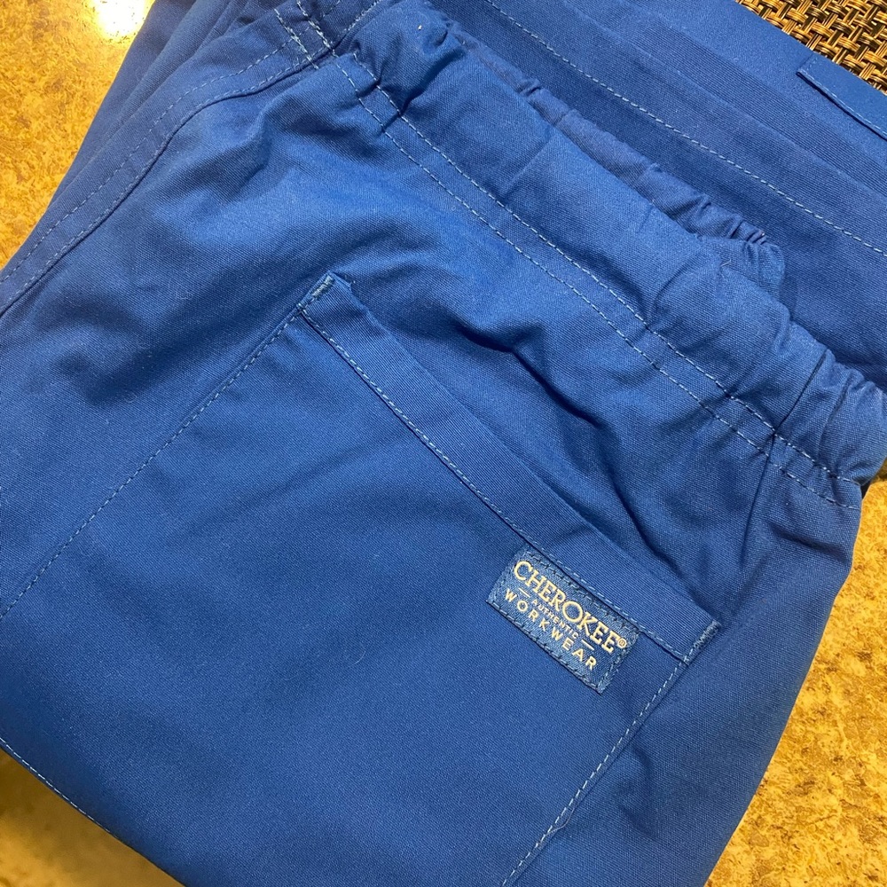 Royal blue drawstring Cherokee scrub pants.